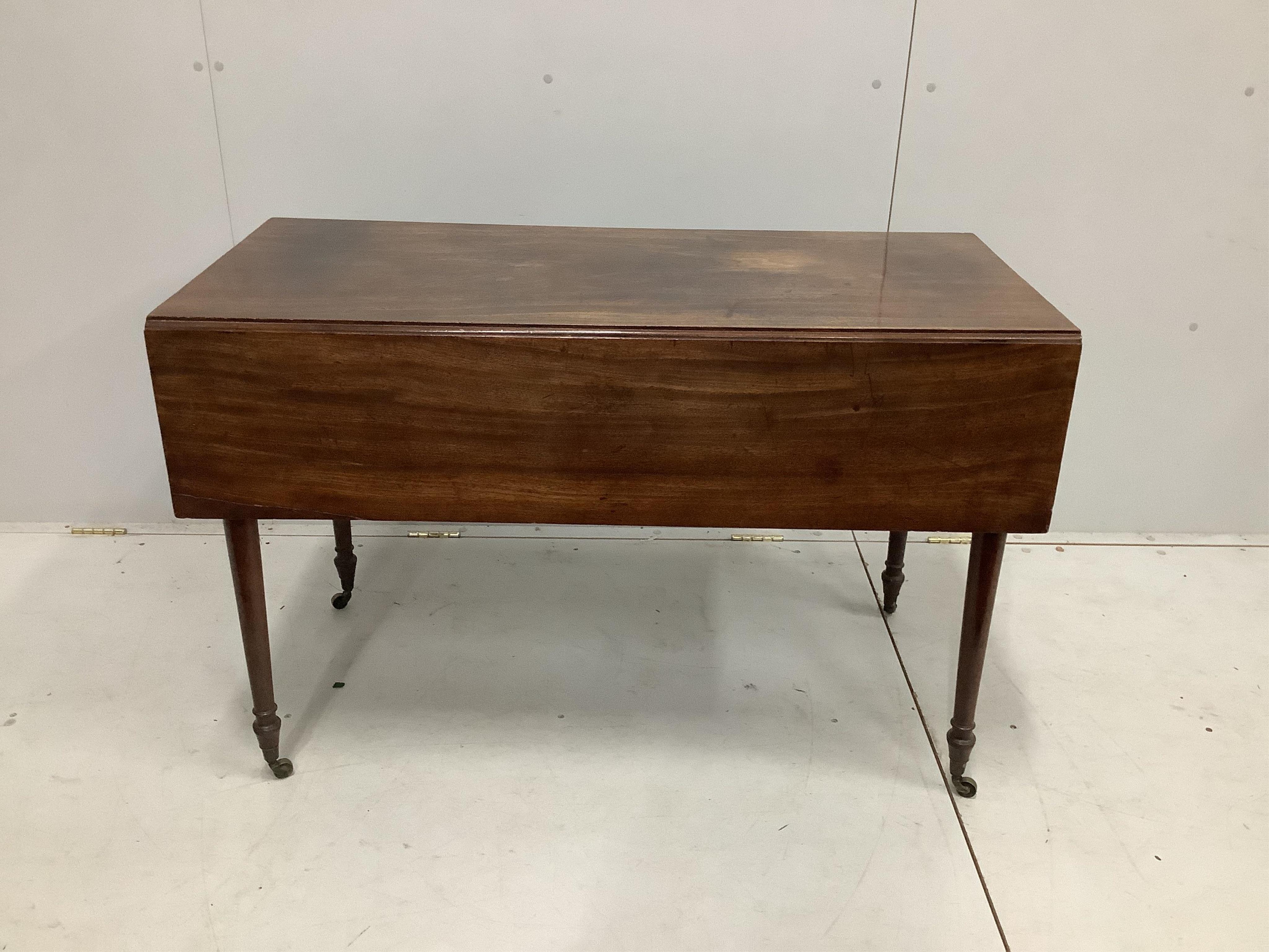 A Regency mahogany Pembroke table, on turned legs with castors, width 112cm, depth 53cm, height 72cm. Condition - fair